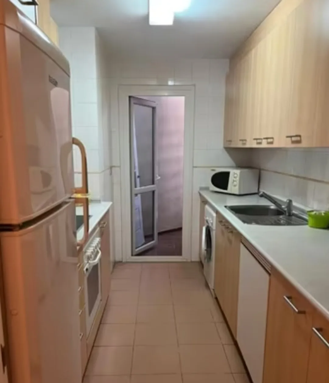 Cocina con lavadora – Venta de apartamento en La Noria con piscina
